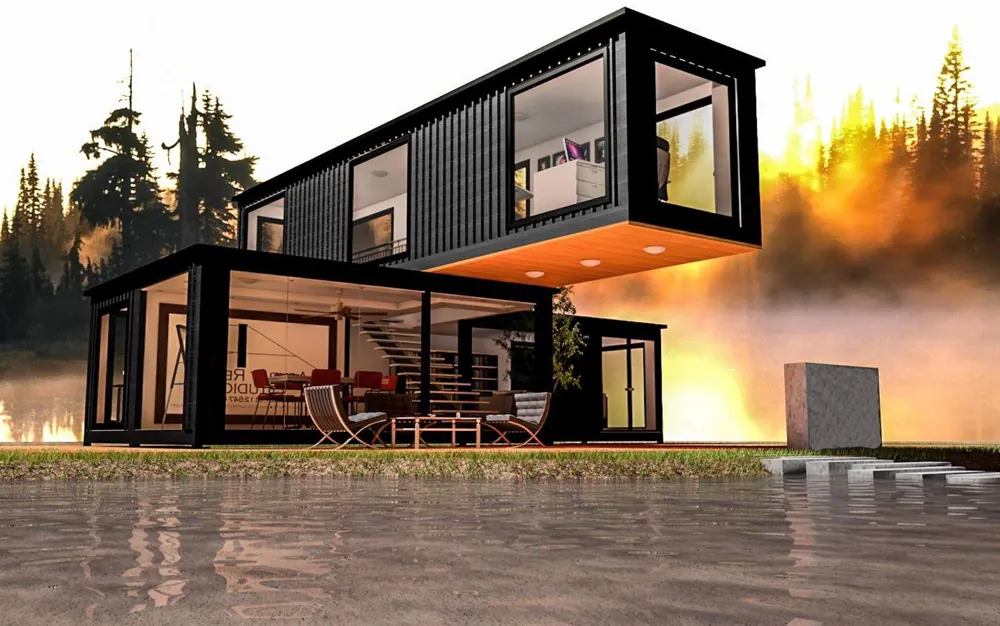 Schwarzes Containerhaus mit auskragendem Obergeschoss und Glasfront bei Sonnenuntergang